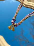Collier en cordon tressé pour femme avec deux breloques tour eiffel